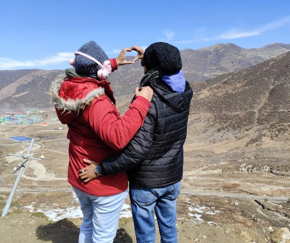 Guests standing at Kupup Lake during their Silk Route Tour Packages from NJP station